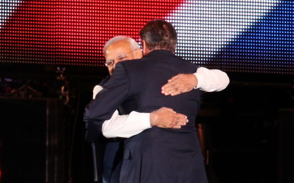 Indian Prime Minister Narendra Modi is welcomed on stage by David Cameron at Wembley Stadium in November 2015 - Credit: Getty