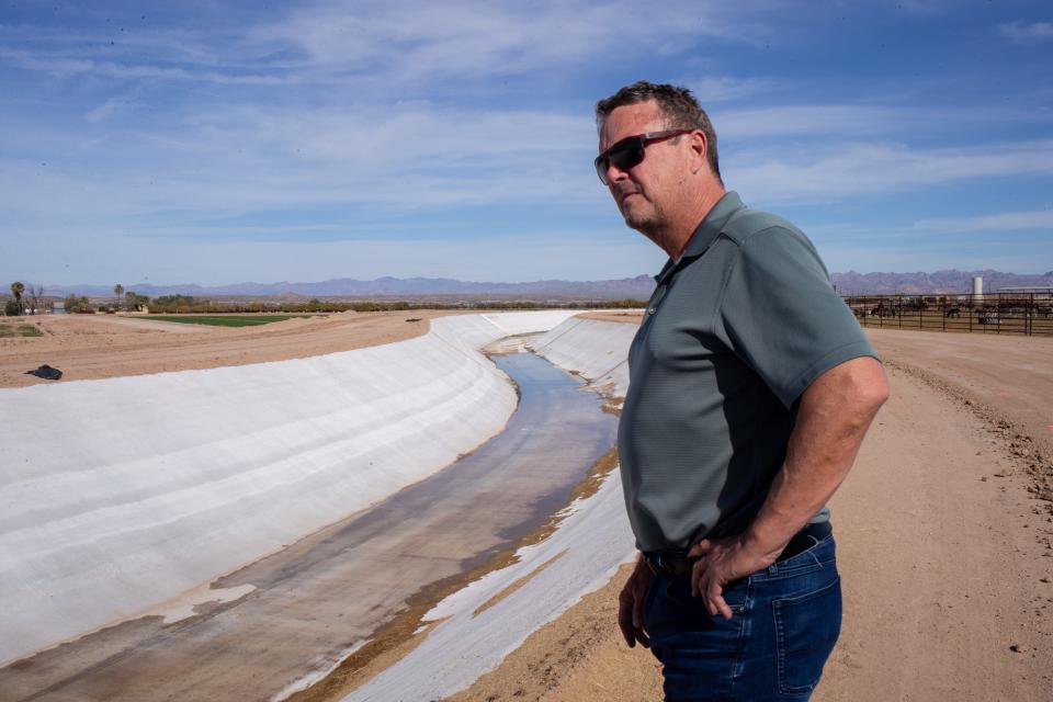 A portrait of Shane Lindstrom (San Carlos Irrigation and Drainage District) on Dec. 13, 2021, next to the Florence Canal that was recently lined with concrete in Florence, Arizona.