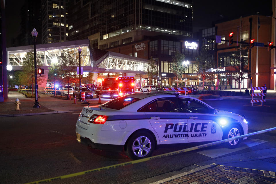 Law enforcement officials respond to reports of a shooting at Ballston Quarter mall in Arlington, Va., Saturday, Sept. 14, 2019. Authorities said they have found no evidence that a shooting occurred at a movie theater that is part of the mall. Reports of a shooting had prompted panic and a large police presence Saturday night. (AP Photo/Patrick Semansky)