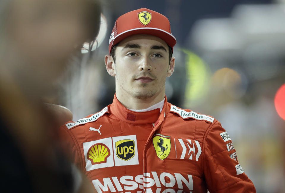 Ferrari driver Charles Leclerc of Monaco celebrates his pole position after the qualifying session at the Formula One Bahrain International Circuit in Sakhir, Bahrain, Saturday, March 30, 2019. The Bahrain Formula One Grand Prix will take place on Sunday. (AP Photo/Luca Bruno)