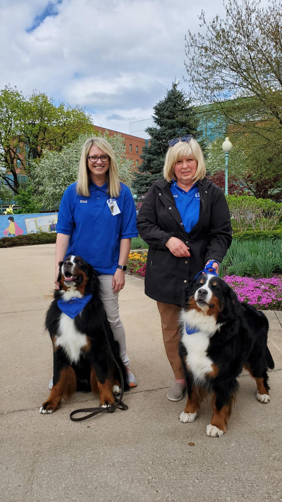 Wendy McGill Sawyer, and her dog Memphis, and Jeannie Bussey, and her dog Faith, are part of the Doggie Brigade at Akron Children's Hospital. Faith is Memphis' mother.