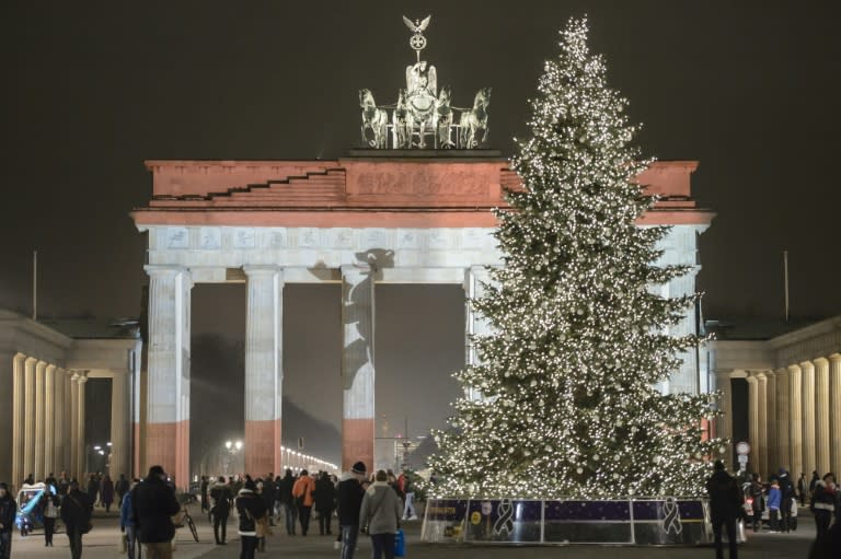 The Brandenburg Gate is seen illuminated in the colors of the flag of Berlin during a rehearsal ahead of the official remembrance ceremony in Berlin on December 20, 2016, a day after a terror attack on a Christmas market