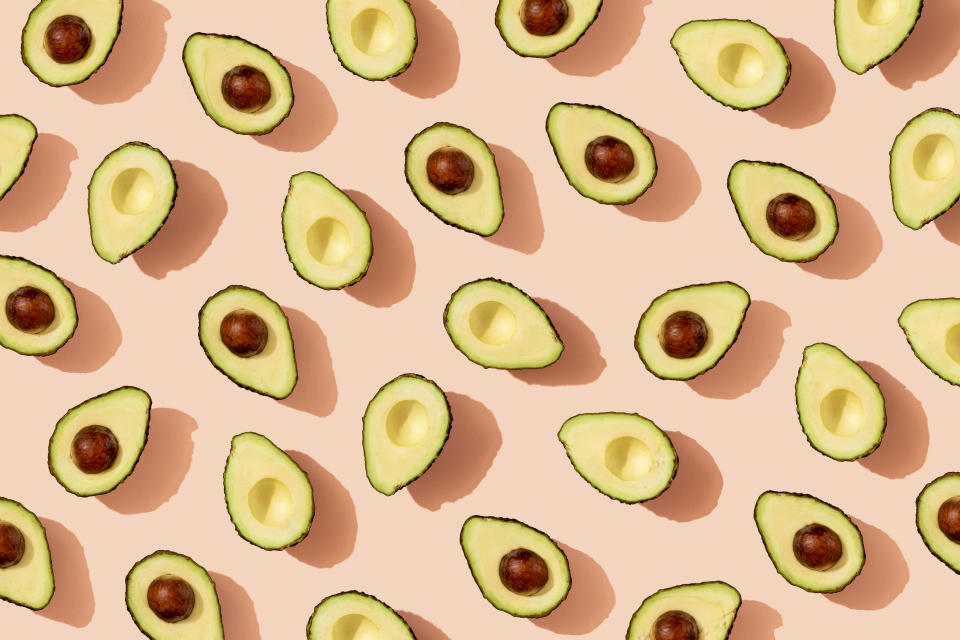 avocados against a pink backdrop