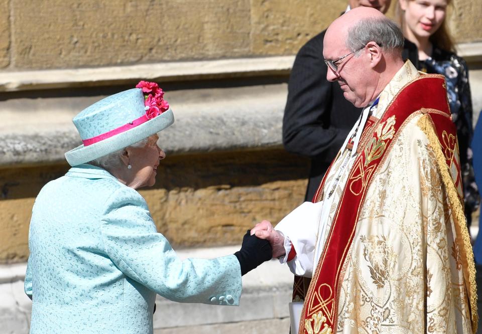 Queen Elizabeth (L) is welcomed by The Dean of Windsor David Conner (EPA)