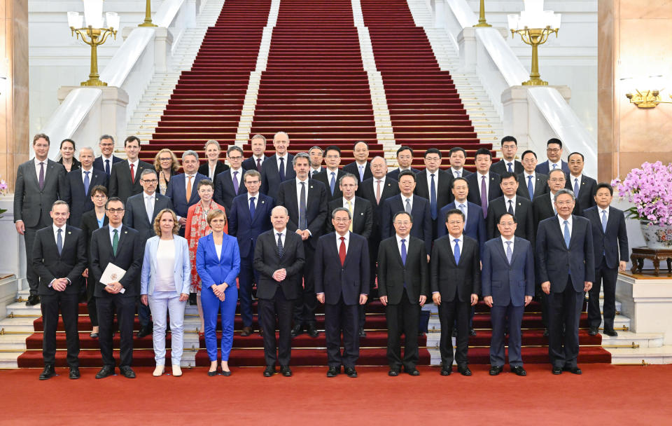 In this photo released by Xinhua News Agency, Chinese Premier Li Qiang and German Chancellor Olaf Scholz jointly attend a meeting of the China-Germany economic advisory committee at the Great Hall of the People in Beijing, Tuesday, April 16, 2024. Europe wants two things from China: First, a shift in its relatively pro-Russia position on the war in Ukraine. Second, a reduction in the trade imbalance. It’s not clear if it will get very far on either front. (Yin Bogu/Xinhua via AP)