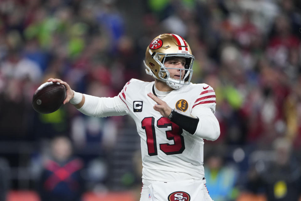 San Francisco 49ers quarterback Brock Purdy throws during the first half of an NFL football game against the Seattle Seahawks, Thursday, Nov. 23, 2023, in Seattle. (AP Photo/Lindsey Wasson)