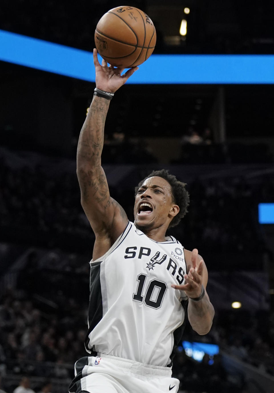 San Antonio Spurs guard DeMar DeRozan shoots during the second half of an NBA basketball game against the Golden State Warriors, Tuesday, Dec. 31, 2019, in San Antonio. San Antonio won 117-113 in overtime. (AP Photo/Darren Abate)