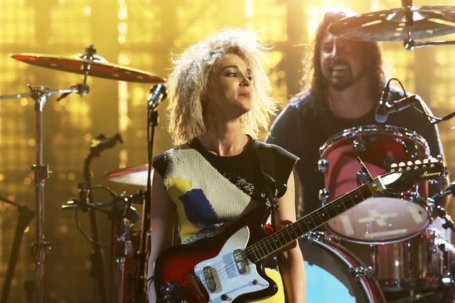 <p>Kevin Kane/WireImage</p> St. Vincent and Dave Grohl at the Rock and Roll Hall of Fame induction in New York City in April 2014