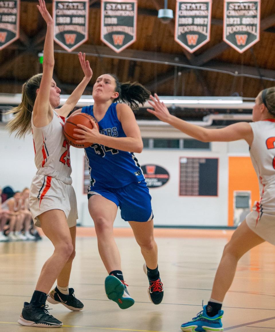 Dover-Sherborn sophomore Elliana Scalabrine drives to the hoop against Wayland, Feb. 6, 2023.