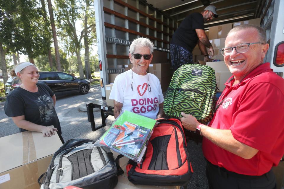 Marvin Miller, president of the Jewish Federation of Volusia & Flagler Counties, joins Robert Voges, principal of Holly Hill School, to survey a truckload of 150 backpacks delivered to the school on Tuesday as part of the Federation's annual Operation Backpack program. The school supply drive will provide some 9,000 backpacks to 89 schools in Volusia and Flagler counties.