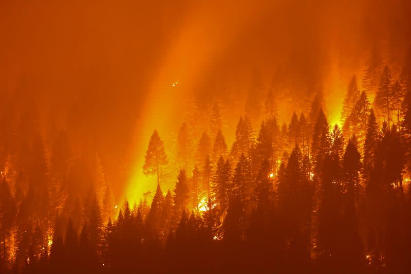 FILE PHOTO: The Dixie Fire, California’s largest active fire burns at night in Taylorsville