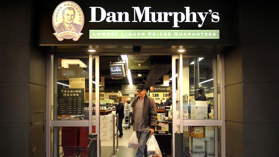 Customer leaves a Dan Murphy&#39;s liquor store in Sydney.