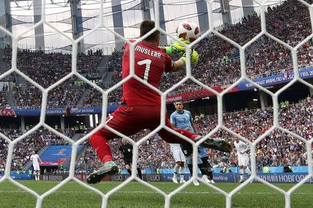 Soccer Football - World Cup - Quarter Final - Uruguay vs France - Nizhny Novgorod Stadium, Nizhny Novgorod, Russia - July 6, 2018 Uruguay's Fernando Muslera fumbles the ball as France's Antoine Griezmann scores their second goal REUTERS/Damir Sagolj