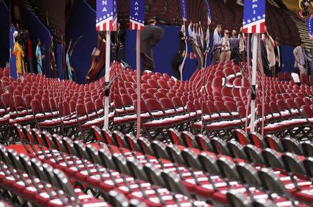 Seats for the delegates to the 2016 Republican National convention are reflected in a mirror on the floor of the convention before the start of the first session at the Republican National Convention in Cleveland, Ohio, U.S. July 18, 2016. REUTERS/Jonathan Ernst