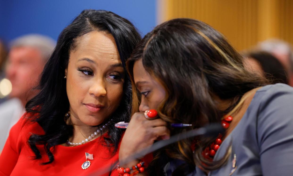 <span>Fani Willis and prosecutor Daysha Young speak to each other during a hearing on the Georgia election interference case on 1 March 2024 in Atlanta, Georgia.</span><span>Photograph: Alex Slitz/AP</span>