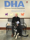 FILE - This Nov. 16, 2018, photo, provided by the Delaware Humane Association shows Joe Biden and his newly-adopted German shepherd Major, in Wilmington, Del. President-elect Biden will likely wear a walking boot for the next several weeks as he recovers from breaking his right foot while playing with his dog Major on Saturday, Nov. 28, 2020, his doctor said. (Stephanie Carter/Delaware Humane Association via AP)