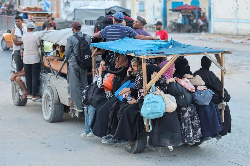 Palestinians flee Bureij after Israeli evacuation order, in the central Gaza Strip