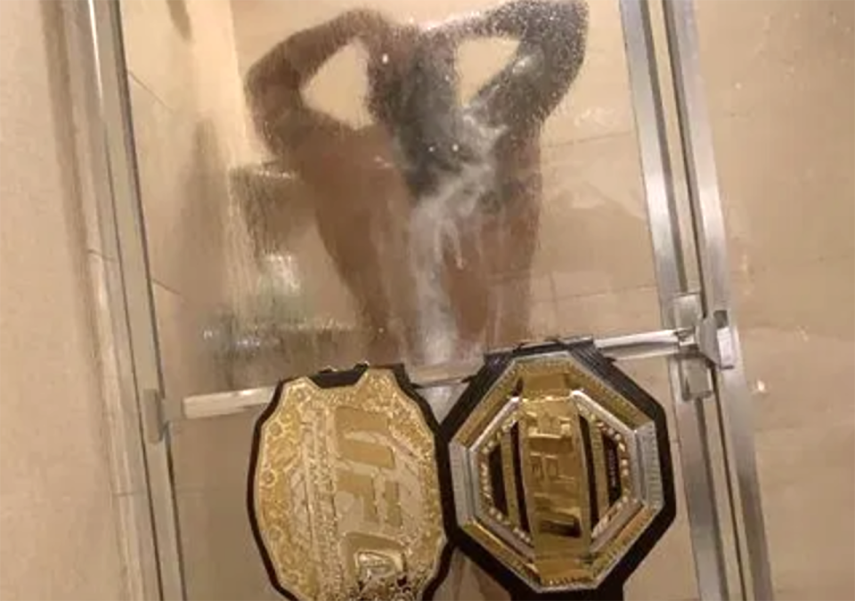 Amanda Nunes, pictured here with her title belts in the shower.