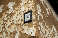 <p>A death notice hangs on a wall of an abandoned house in the empty village of Repusnica, near the southeastern town of Knjazevac, Serbia, Aug. 15, 2017. (Photo: Marko Djurica/Reuters) </p>