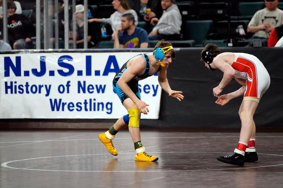 Ryan Kozdra of Mahwah, left, and Ryan Ford of Bergen Catholic wrestle in a 132-pound bout on Day 1 of the NJSIAA state wrestling championships in Atlantic City on Thursday, March 3, 2022.