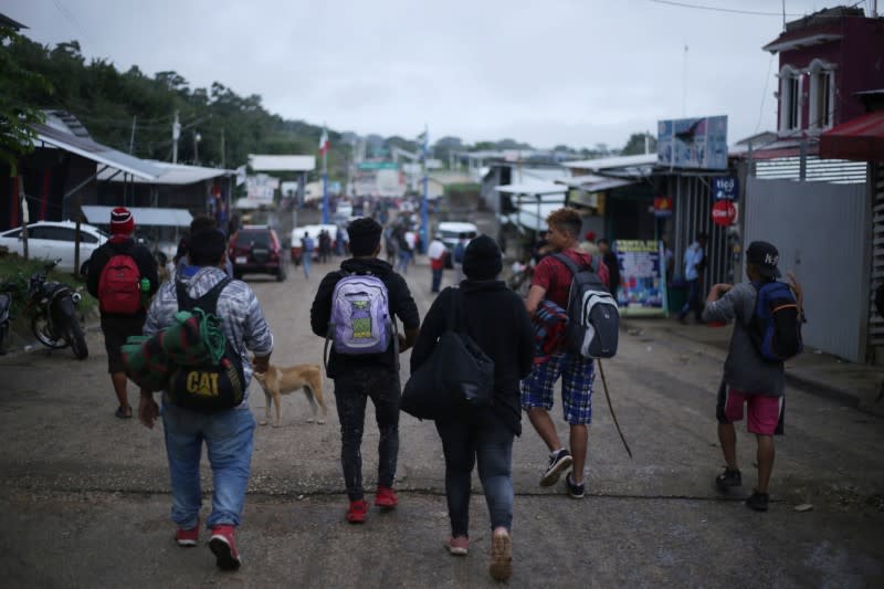 Migrants from Central American, part of a caravan travelling to the U.S., arrive at the border between Guatemala and Mexico, in El Ceibo