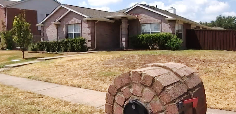 The home in Allen, Texas, where police say they found four people dead in what investigators say is an apparent murder-suicide. (NBC Dallas-Fort Worth)