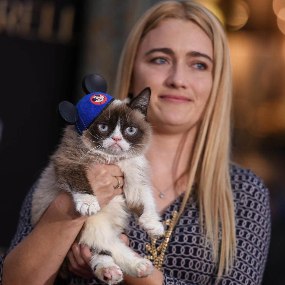 Grumpy Cat and Tabatha Bundesen arrive at the World Premiere Of "Cinderella" on Sunday, March 1, 2015, in Los Angeles. (Photo by Richard Shotwell/Invision/AP)