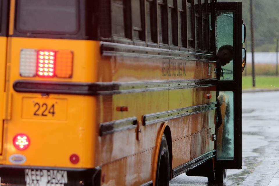 In this file photo, New Bedford High School students step off the bus as a school day gets set to begin. Starting Jan. 2, NBHS' dismissal time will move to 2:12 p.m., 28 minutes earlier than its prior time.