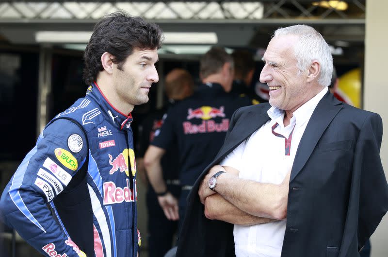 Red Bull Formula One driver Mark Webber of Australia speaks with Red Bull owner Dietrich Mateschitz before the Abu Dhabi F1 Grand Prix at Yas Marina circuit