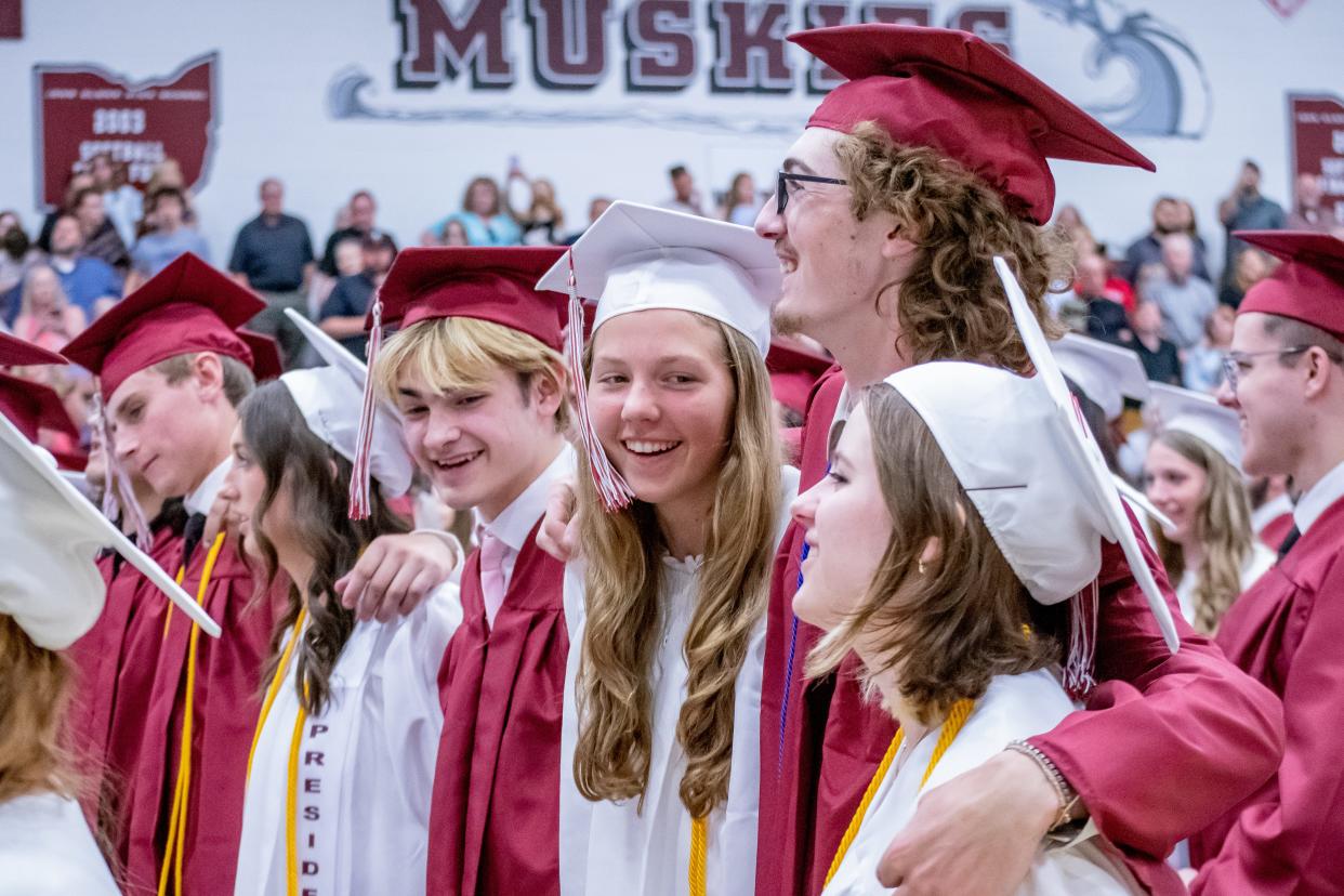Graduates laugh and cherish the moment as the John Glenn alma mater is sung at the 113th annual commencement ceremony on Friday. For more photos visit www.daily-jeff.com