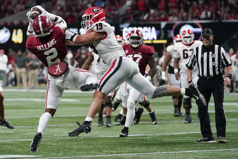 Alabama defensive back DeMarcco Hellams (2) picks off the ball intended for Georgia tight end Brock Bowers (19) during the second half of the Southeastern Conference championship NCAA college football game, Saturday, Dec. 4, 2021, in Atlanta. (AP Photo/Brynn Anderson)