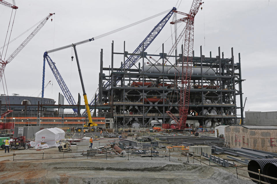 FILE - In this Sept. 21, 2016, file photo, V.C. Summer Nuclear Station's unit two's turbine is under construction near Jenkinsville, S.C., during a media tour of the facility. The Public Service Commission will determine at a meeting on Friday, Dec. 14, 2018 how much to cut rates for 737,000 South Carolina Electric & Gas customers who have already paid more than $2 billion for a pair of nuclear reactors abandoned during construction. (AP Photo/Chuck Burton, File)