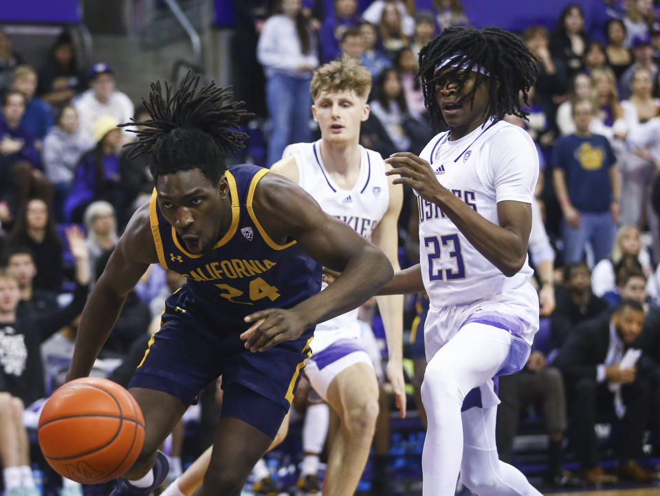 California forward Sam Alajiki (24) reacts after getting tripped by Washington guard Keyon Menifield (23) during the first half of an NCAA college basketball game Saturday, Jan. 14, 2023, in Seattle. (AP Photo/Lindsey Wasson)