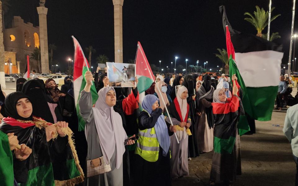 People protest against Israeli airstrike on Gaza's Al-Ahli Baptist Hospital, at Martyrs' Square in Tripoli