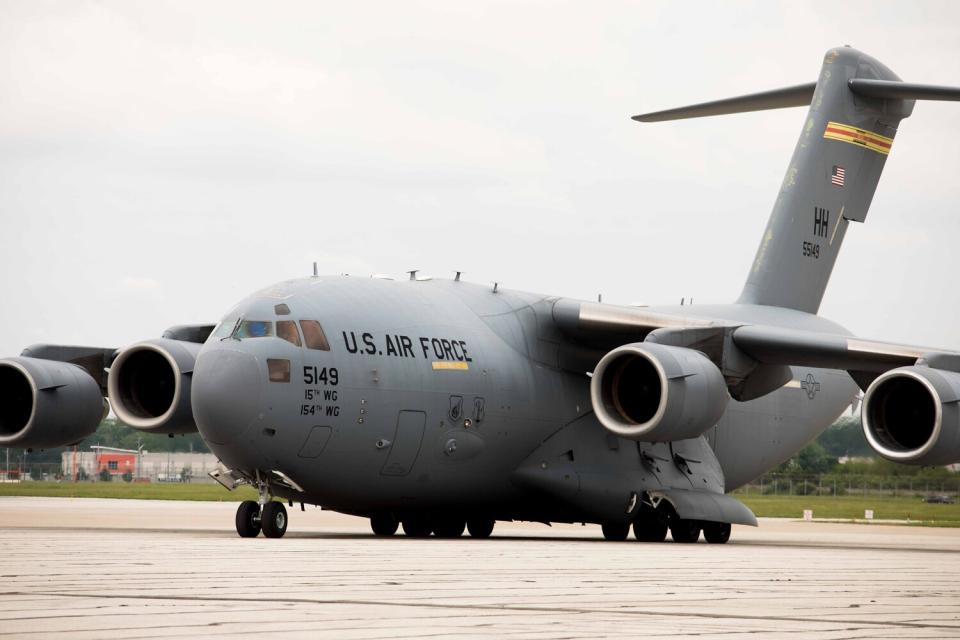 A US military aircraft carrying 132 pallets of Nestle Health Science Alfamino Infant and Alfamino Junior formula arrives to Indianapolis International Airport in Indianapolis, Indiana, US, on Sunday, May 22, 2022. The first air shipment of baby formula, originating from Zurich, Switzerland, was delivered under the Operation Fly Formula emergency program authorized by President Biden to address a national shortage that has parents struggling to meet the needs of their newborns.