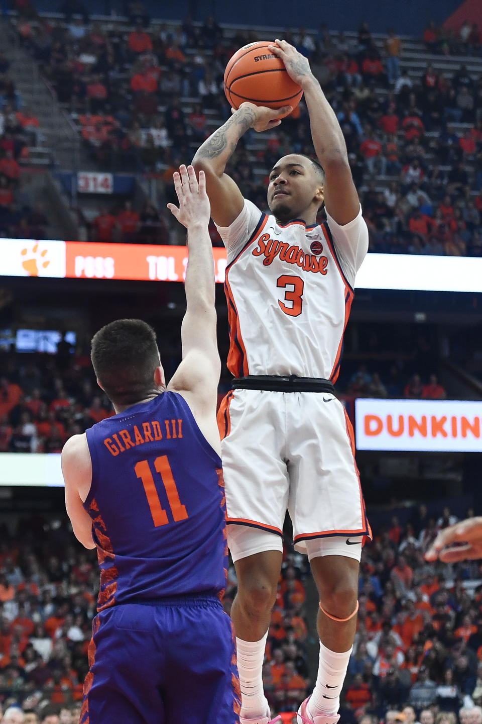 Syracuse guard Judah Mintz (3) shoots over Clemson guard Joseph Girard III (11) during the second half of an NCAA college basketball game in Syracuse, N.Y., Saturday, Feb. 10, 2024. (AP Photo/Adrian Kraus)