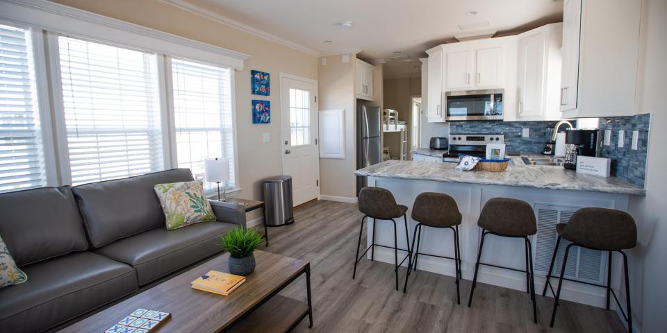 A kitchen and living room inside a cabana cabin at Camp Margaritaville in Auburndale, Florida.