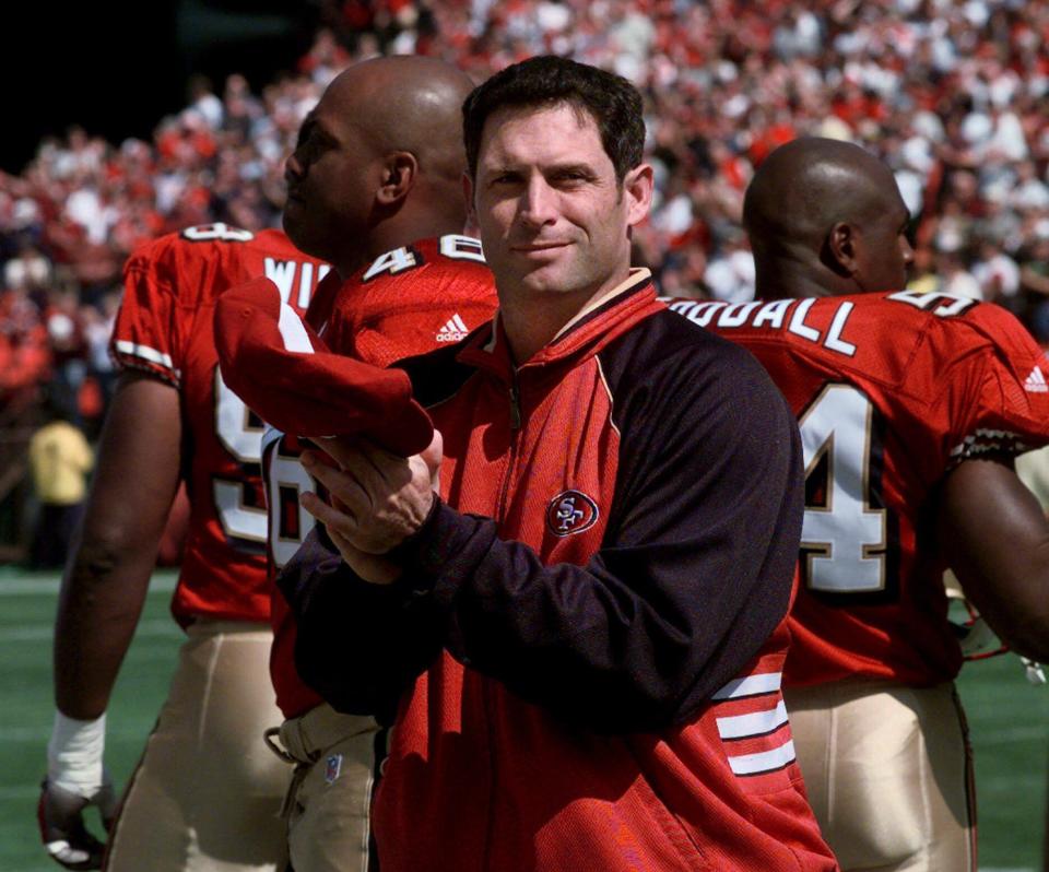 San Francisco 49ers quarterback Steve Young applauds his team on the sidelines during the 49ers’ win over the Tennessee on Sunday, Oct. 3, 1999 in San Francisco. | Paul Sakuma, Associated Press