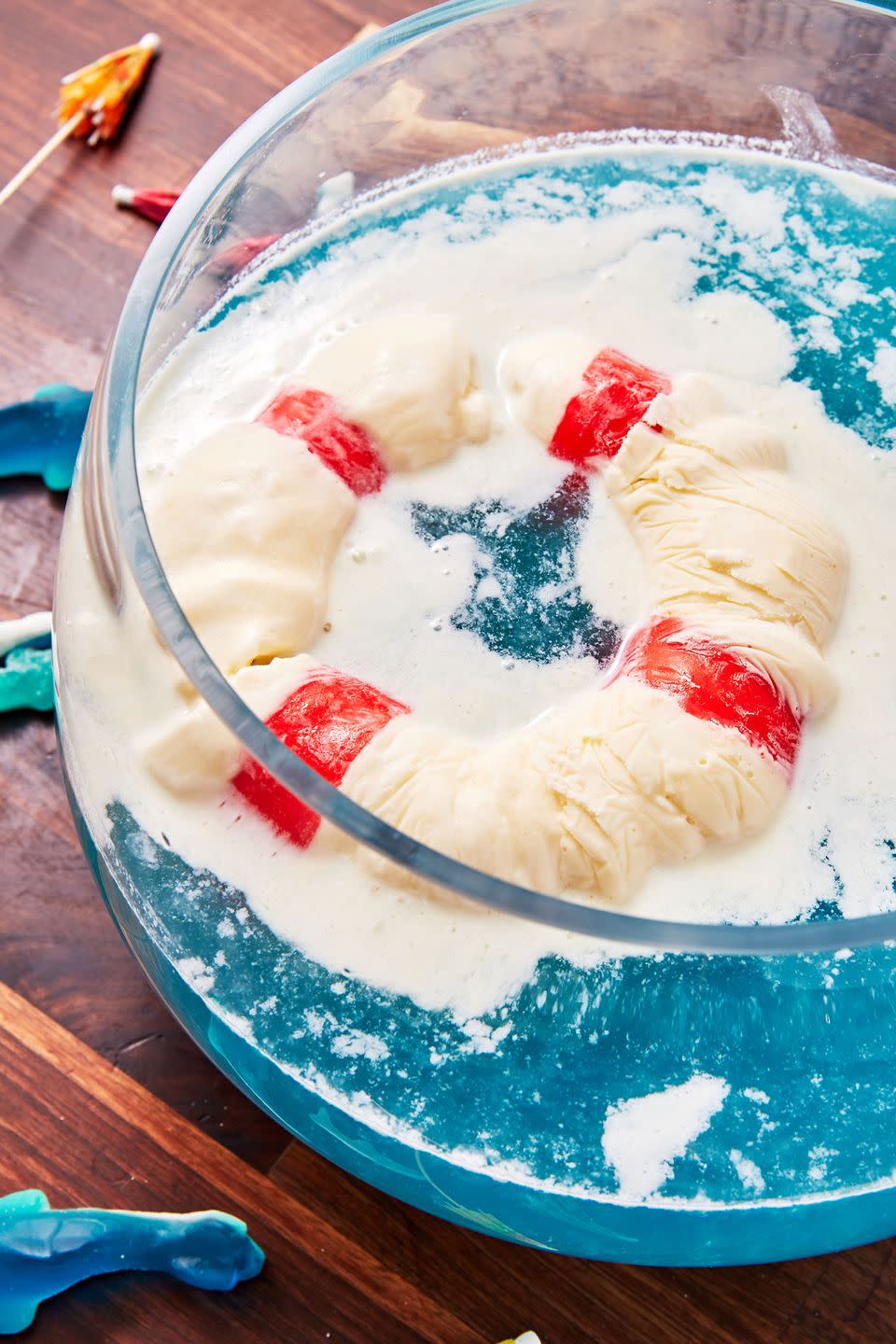 <p>Be sure to prepare the "lifesaver" well in advance so that it's fully frozen. As it melts it will create the foamy white waves and make the punch extra creamy. </p><p>Get the recipe from <a href="https://www.delish.com/cooking/recipe-ideas/recipes/a54243/shark-punch-recipe/" rel="nofollow noopener" target="_blank" data-ylk="slk:Delish;elm:context_link;itc:0;sec:content-canvas" class="link ">Delish</a>.</p>
