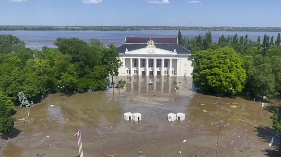 In this handout photo taken from video released by Russian-controlled administration of Kherson Region on Wednesday, June 7, 2023, the central square of Nova Kakhovka is flooded after the Kakhovka dam was blown up, in the Russian-controlled part of the Kherson Region, Ukraine. (Russian-controlled administration of Kherson Region via AP)