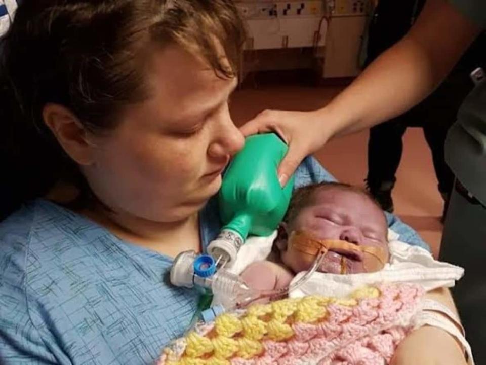 Crystal Whalen holds her daughter, Karlee, on Jan. 19, 2019, at the Health Sciences Centre in St. John's. (Crystal Whalen/Facebook - image credit)