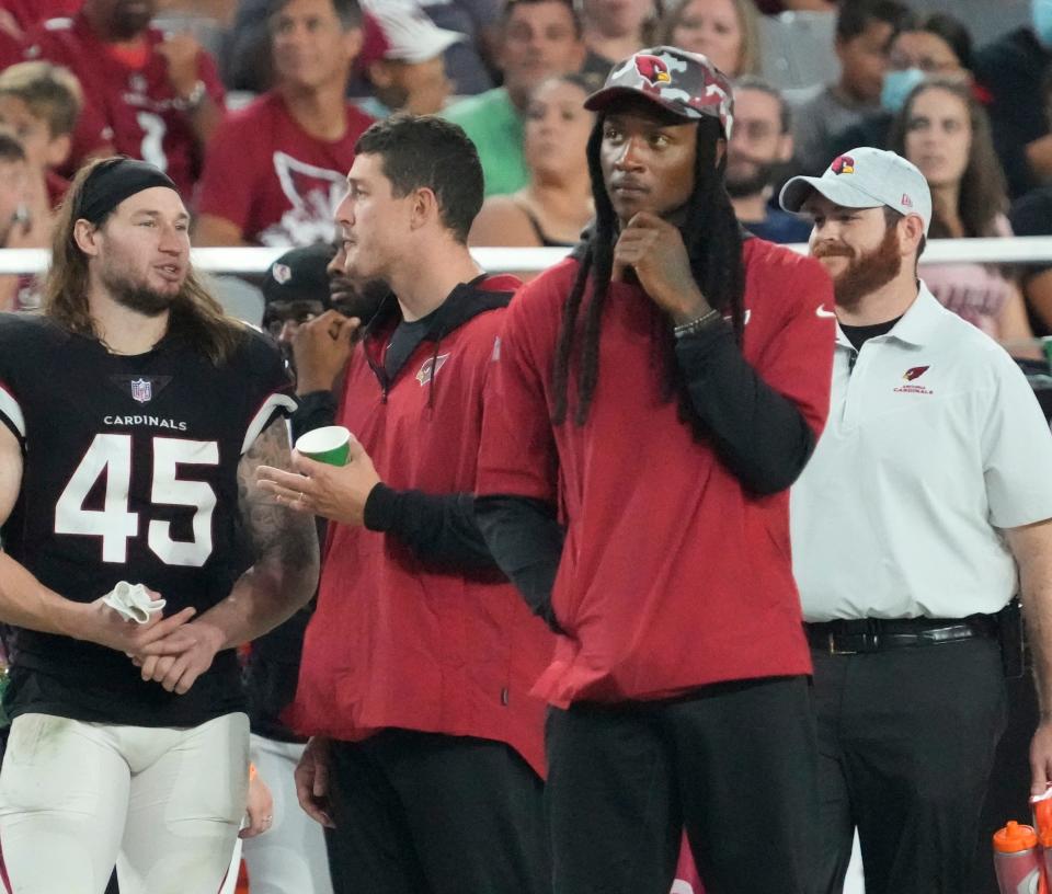 Aug 21, 2022; Glendale, Ariz., United States;  Arizona Cardinals wide receiver DeAndre Hopkins watches his team play against the Baltimore Ravens during the second quarter in preseason action at State Farm Stadium.
