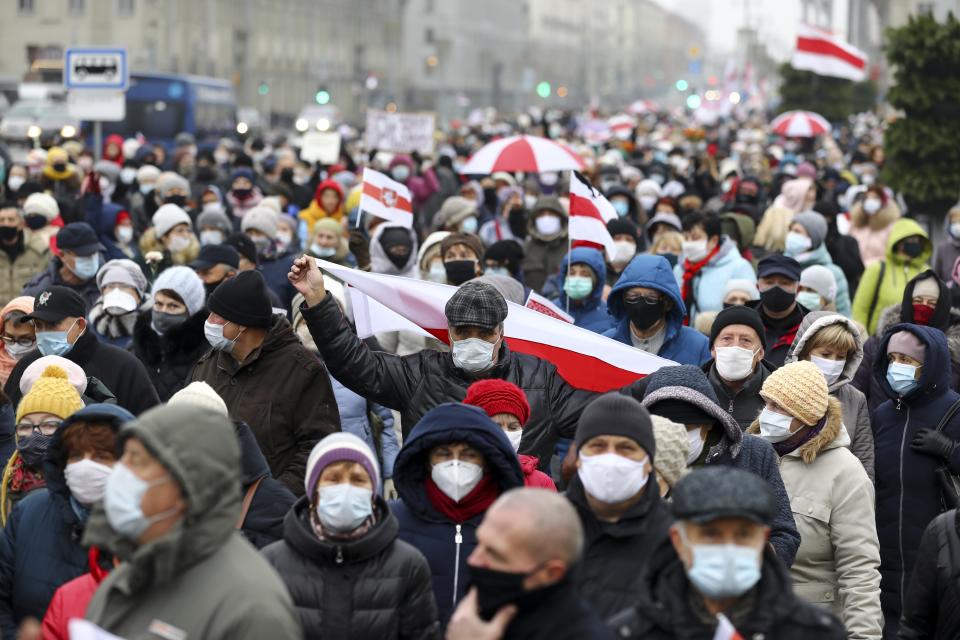 Belarusian pensioners wearing face masks to protect against coronavirus attend an opposition rally to protest the official presidential election results in Minsk, Belarus, Monday, Nov. 16, 2020. Crowds of retirees marched down the streets of the Belarusian capital on Monday, demanding the resignation of the country's authoritarian president and to end the government crackdown on peaceful protesters. (AP Photo)