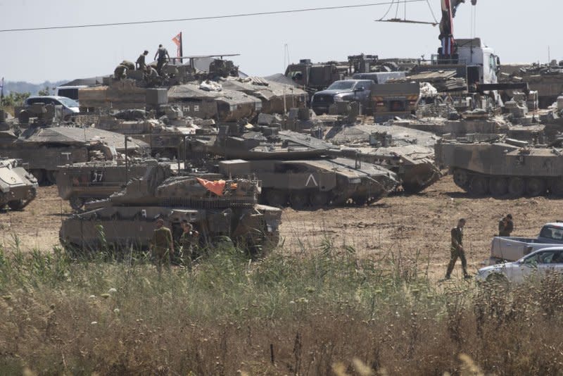 Israeli troops mass on the Israeli border near Rafah on Tuesdays=. Photo by Jim Hollander/UPI