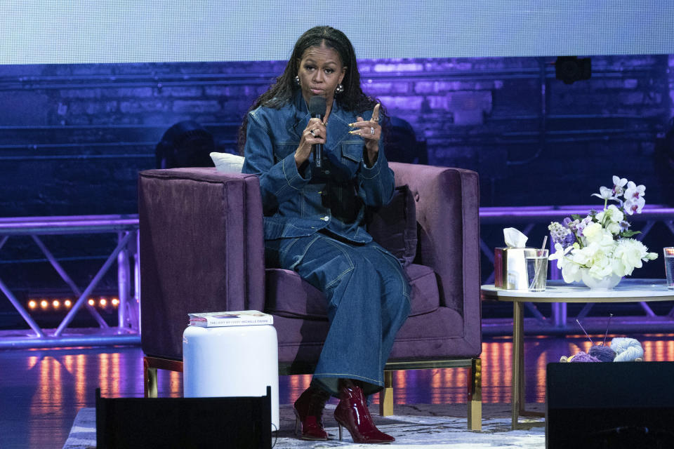 Michelle Obama launches her new book “The Light We Carry: Overcoming in Uncertain Times.” at Warner Theater in Washington, Tuesday, Nov. 15, 2022. ( AP Photo/Jose Luis Magana)