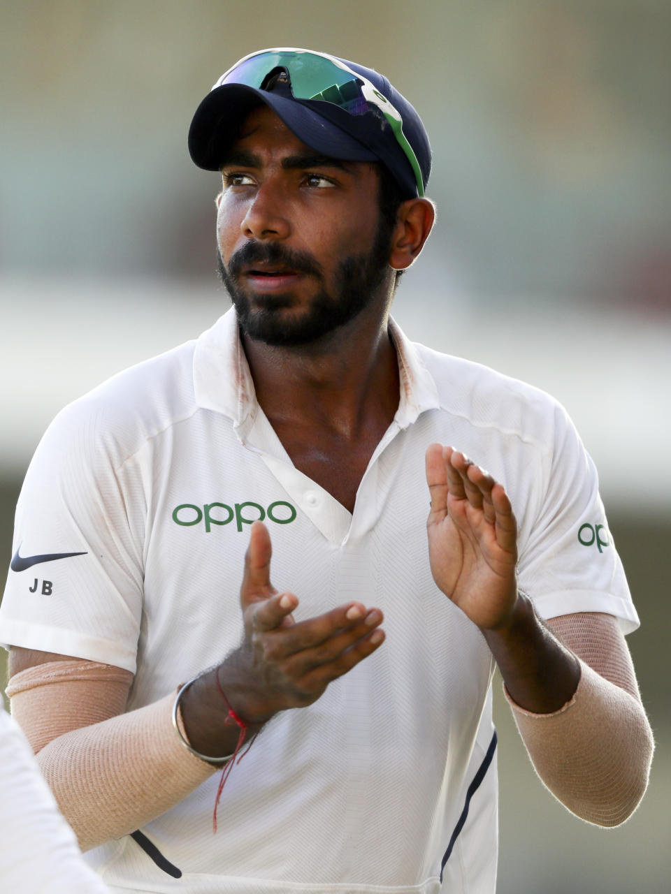 India's Jasprit Bumrah applauds as he leaves the field after day two of the second Test cricket match against West Indies at Sabina Park cricket ground in Kingston, Jamaica Saturday, Aug. 31, 2019. Bumrah took six wickets. (AP Photo/Ricardo Mazalan)