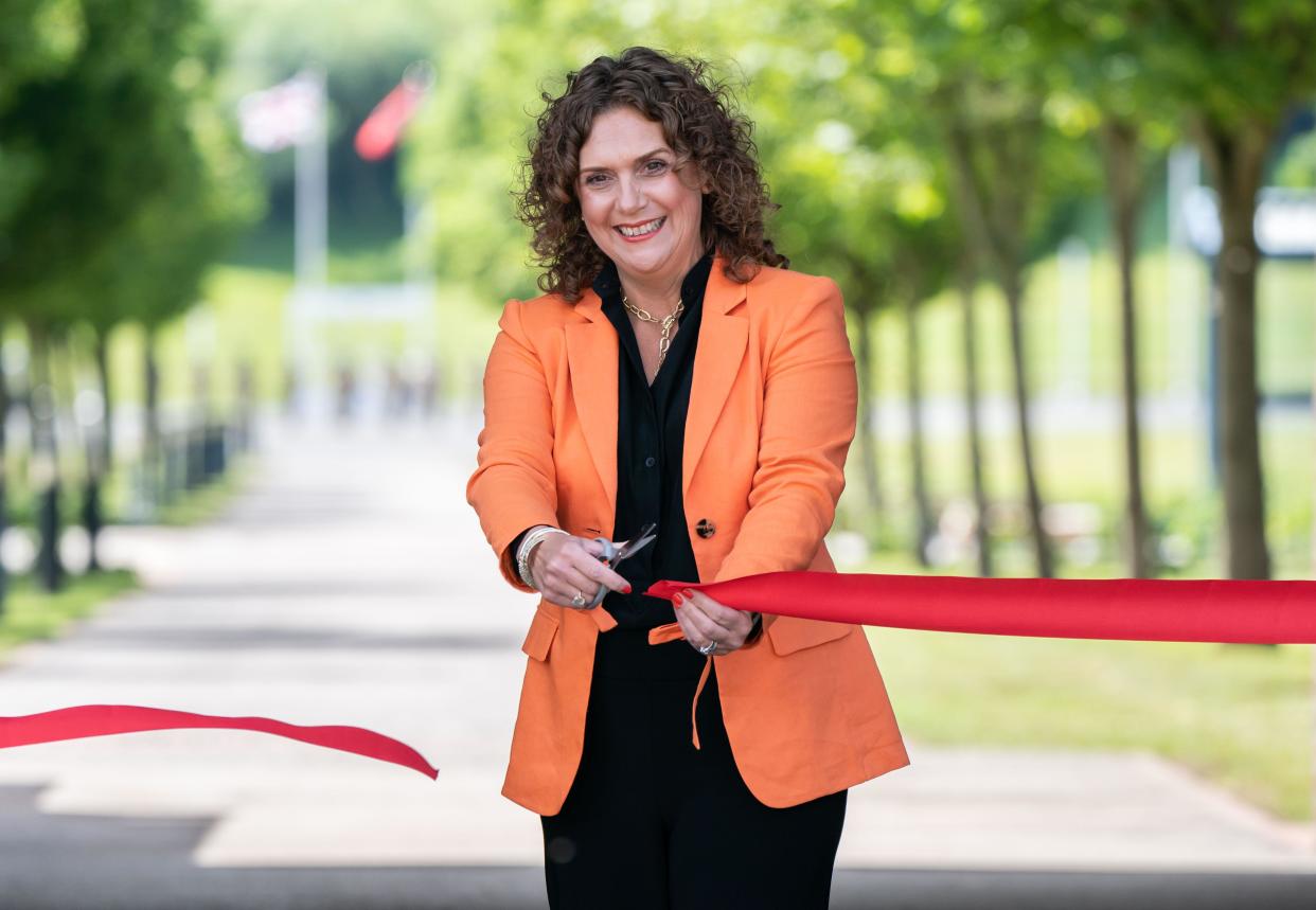 Hannah Ingram-Moore, daughter of Captain Sir Tom Moore, cuts a ribbon to officially open a walkway dedicated to Captain Tom at the Army Foundation College in Harrogate, North Yorkshire. Picture date: Wednesday July 7, 2021.