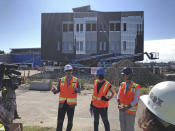 In this July 22, 2019, photo, Scott Ashford, dean of Oregon State University's college of engineering, describes to the media the university's Marine Studies Building, which is being built in a tsunami inundation zone in Newport, Ore. The plan to build it was controversial from the moment it was announced, but now the state's elected officials have gone a step further by repealing a quarter-century-old ban on construction of critical facilities in tsunami inundation zones along the Oregon coast. (AP Photo/Andrew Selsky)