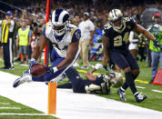 <p>Los Angeles Rams running back Malcolm Brown (34) scores a touchdown in front of New Orleans Saints free safety Marcus Williams (43) and strong safety Vonn Bell (24) in the second half of an NFL football game in New Orleans, Sunday, Nov. 4, 2018. (AP Photo/Butch Dill) </p>