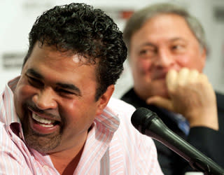 Ozzie Guillen laughs as Miami owner Jeffrey Loria looks on during the September press conference introducing Guillen as manager